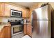 Updated kitchen featuring stainless steel appliances, light wood cabinets and granite countertops at 3221 White Ibis Ct # D2, Punta Gorda, FL 33950