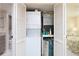 The laundry area has a stacked washer and dryer and the home's air handler at 3221 White Ibis Ct # D2, Punta Gorda, FL 33950