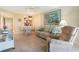 A comfy living room and dining area with tile floors and natural lighting at 3221 White Ibis Ct # D2, Punta Gorda, FL 33950