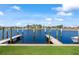 A picturesque waterfront view featuring a dock and boat slip, perfect for enjoying the coastal lifestyle at 3221 White Ibis Ct # D2, Punta Gorda, FL 33950
