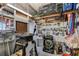 Well-organized garage with tools, equipment, and storage solutions for various projects and equipment at 3305 Blue Jay Ln, Englewood, FL 34224