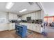 Updated kitchen featuring custom cabinets, granite countertops, a stylish backsplash and stainless appliances at 3305 Blue Jay Ln, Englewood, FL 34224