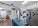 Updated kitchen seamlessly connects to the dining and living area with stainless appliances and custom cabinets at 3305 Blue Jay Ln, Englewood, FL 34224