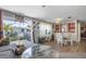 Open living and dining space with access to a balcony and a bright, airy atmosphere at 3305 Blue Jay Ln, Englewood, FL 34224