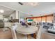 Open concept living room that flows from kitchen and dining, ideal for entertaining at 3305 Blue Jay Ln, Englewood, FL 34224