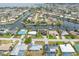 Neighborhood aerial view showcases a home nestled in a waterfront community with easy access to canals and the sea at 340 Belaire Ct, Punta Gorda, FL 33950