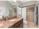 Bathroom featuring granite countertops, a sink, a glass shower and toilet with decorative hardware at 340 Belaire Ct, Punta Gorda, FL 33950