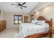 Bright bedroom with neutral tones, natural light, and ceiling fan at 340 Belaire Ct, Punta Gorda, FL 33950