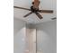 Simple bedroom with a fan, white walls, white trim and a white door at 340 Belaire Ct, Punta Gorda, FL 33950