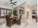 Cozy dining area with wicker chairs and views of the living area at 340 Belaire Ct, Punta Gorda, FL 33950