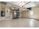 Spacious garage with epoxy floors, storage racks, water heater, and extra refrigerator space at 340 Belaire Ct, Punta Gorda, FL 33950
