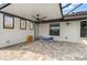 Spacious screened-in lanai with tile flooring, ceiling fan, and ample sunlight at 340 Belaire Ct, Punta Gorda, FL 33950