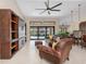 Spacious living room featuring tile floors, comfortable seating, large windows and access to the pool area at 340 Belaire Ct, Punta Gorda, FL 33950