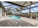 Beautiful pool area offering waterfront views from the screened lanai at 340 Belaire Ct, Punta Gorda, FL 33950