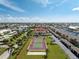 Aerial view of the condo community, tennis courts and surrounding neighborhood with building 10 highlighted in red at 347 Coldeway Dr # G6, Punta Gorda, FL 33950