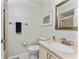 Bathroom featuring a toilet, vanity, and framed art on the wall at 347 Coldeway Dr # G6, Punta Gorda, FL 33950