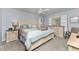 Bright bedroom with light blue walls, ceiling fan, and white wood furniture at 347 Coldeway Dr # G6, Punta Gorda, FL 33950