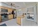 Bright kitchen featuring stainless steel appliances and a convenient pass-through to the patio at 347 Coldeway Dr # G6, Punta Gorda, FL 33950