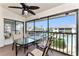 Screened-in patio with pool view, ceiling fan and table and chairs at 347 Coldeway Dr # G6, Punta Gorda, FL 33950
