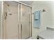 Close-up of tiled shower with sliding glass doors, and towel rack at 347 Coldeway Dr # G6, Punta Gorda, FL 33950