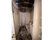 Damaged bathroom with debris, burnt walls, and missing ceiling after a fire at 3538 Pinetree St, Port Charlotte, FL 33952