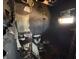 Bathroom damaged by fire with missing walls, burnt ceiling, and destroyed furniture at 3538 Pinetree St, Port Charlotte, FL 33952