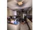 Damaged kitchen with debris, burnt ceiling and walls, and open cabinets after a fire at 3538 Pinetree St, Port Charlotte, FL 33952
