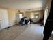 View of the spacious living room featuring tile flooring and natural light at 3538 Pinetree St, Port Charlotte, FL 33952