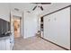 Bedroom with neutral carpet, closet, and a Murphy bed with built-in shelving at 3664 Tin Cup Blvd, Sarasota, FL 34232