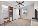 Cozy bedroom featuring neutral carpet, a Murphy bed, and a ceiling fan at 3664 Tin Cup Blvd, Sarasota, FL 34232