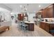 A spacious kitchen with a large island, stainless steel appliances, and beautiful wood cabinets at 3664 Tin Cup Blvd, Sarasota, FL 34232
