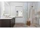 Elegant bathroom with a glass enclosed shower and modern fixtures at 3729 Peace River Dr, Punta Gorda, FL 33983