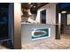 An outdoor kitchen with built-in lighting, stainless steel appliances, and island with custom lighting at 3729 Peace River Dr, Punta Gorda, FL 33983