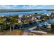 Aerial view of a waterfront community featuring lush landscaping, private docks, and stunning water views at 3729 Peace River Dr, Punta Gorda, FL 33983