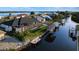 Canal-front home aerial view with a boat lift, dock, and expansive backyard at 3729 Peace River Dr, Punta Gorda, FL 33983