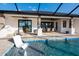 Covered outdoor space with outdoor dining area and pool, perfect for entertaining at 3729 Peace River Dr, Punta Gorda, FL 33983