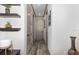 Hallway featuring modern design, neutral paint, and wood flooring with decorative shelving at 3729 Peace River Dr, Punta Gorda, FL 33983