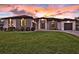Charming single-story home showcases a well-kept lawn, modern design, and elegant entryway at 3729 Peace River Dr, Punta Gorda, FL 33983