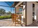 Outdoor kitchen area with bar seating, integrated lighting, and a view of lush landscaping at 3729 Peace River Dr, Punta Gorda, FL 33983