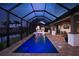 Screened pool with underwater lights and an outdoor kitchen provides luxurious outdoor living at 3729 Peace River Dr, Punta Gorda, FL 33983