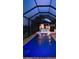 Relaxing pool with built-in seating and outdoor kitchen area, perfect for entertaining at 3729 Peace River Dr, Punta Gorda, FL 33983
