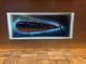 Unique fish artwork enhancing the wall, complemented by tiled flooring for a distinctive aesthetic at 3729 Peace River Dr, Punta Gorda, FL 33983