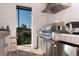 Outdoor kitchen featuring stainless steel appliances and bar, perfect for al fresco dining and entertaining at 3729 Peace River Dr, Punta Gorda, FL 33983
