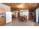 Open concept dining area featuring a round table, wooden accents, and tile flooring at 47350 Bermont Rd, Punta Gorda, FL 33982
