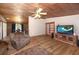 Bright living room with hardwood floors and a modern entertainment center at 47350 Bermont Rd, Punta Gorda, FL 33982