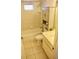 Clean bathroom featuring tiled walls, a tub-shower combination, vanity sink, and built-in storage cabinet at 5050 Prosch Cir, North Port, FL 34288