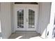 Double doors with decorative grids and modern door hardware provides privacy and security at 5050 Prosch Cir, North Port, FL 34288