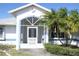 This charming single Gathering home features a screened-in front porch, tropical landscaping and lots of curb appeal at 5050 Prosch Cir, North Port, FL 34288