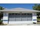 Detached garage with two bays and gray doors, enhancing the property's functionality at 5050 Prosch Cir, North Port, FL 34288