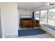 Enclosed porch with large windows and a hot tub, offering a relaxing indoor-outdoor space at 5050 Prosch Cir, North Port, FL 34288